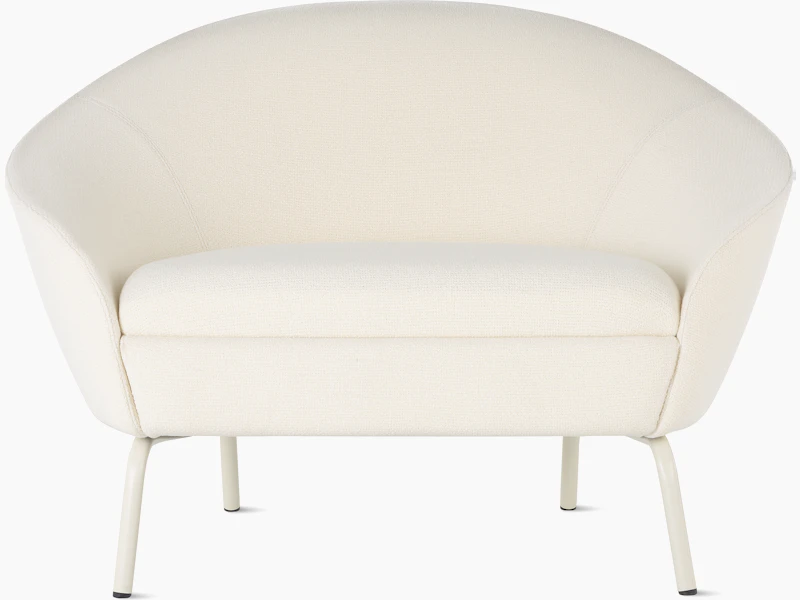 Front view of cream upholstered Ever Lounge Chair with oyster steel legs.