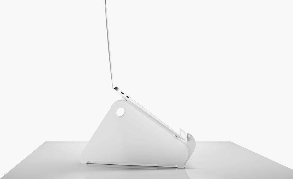 Side profile of an open and raised laptop on an Oripura Laptop Stand.