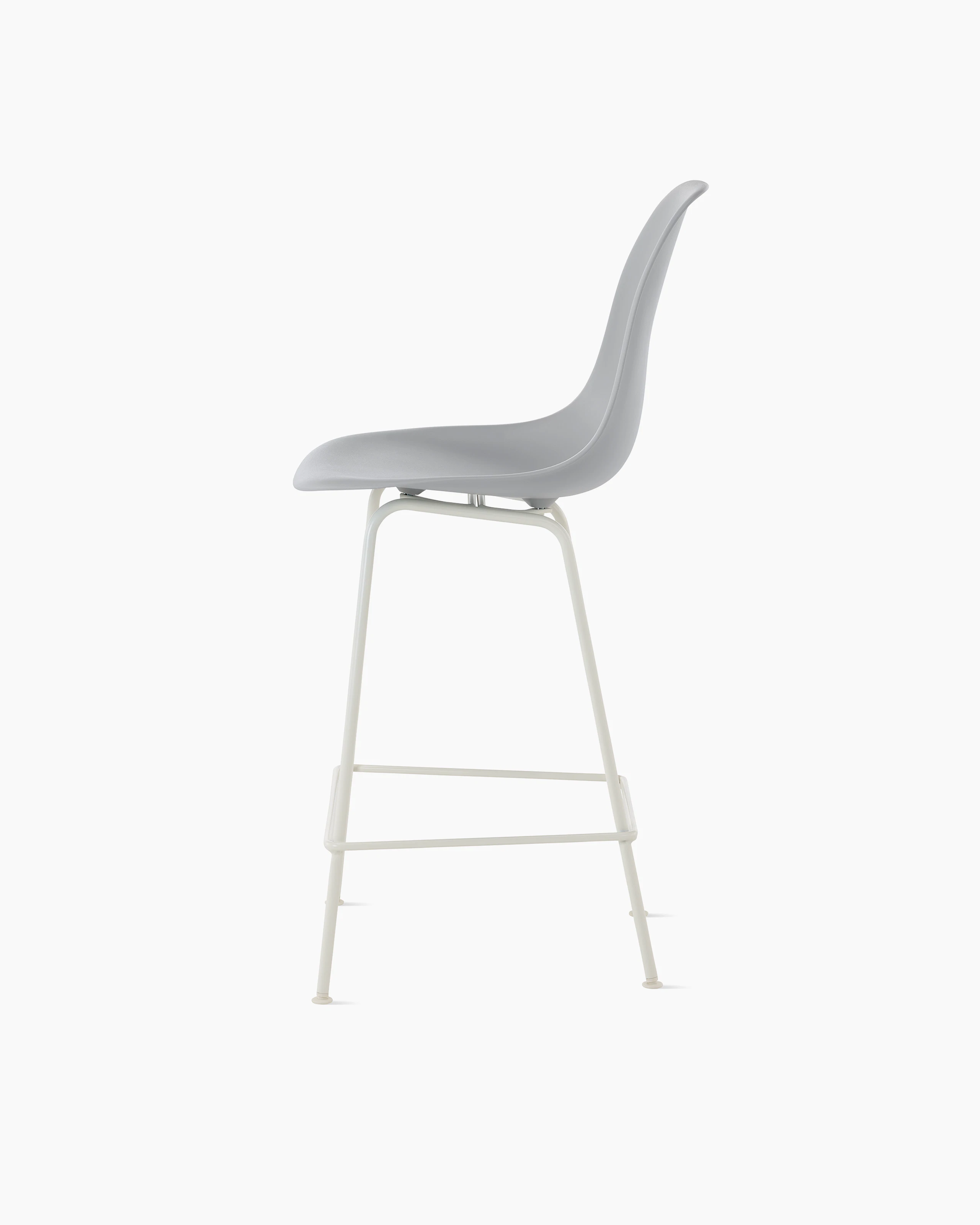 Side of light grey plastic shell stool on 4 leg base.