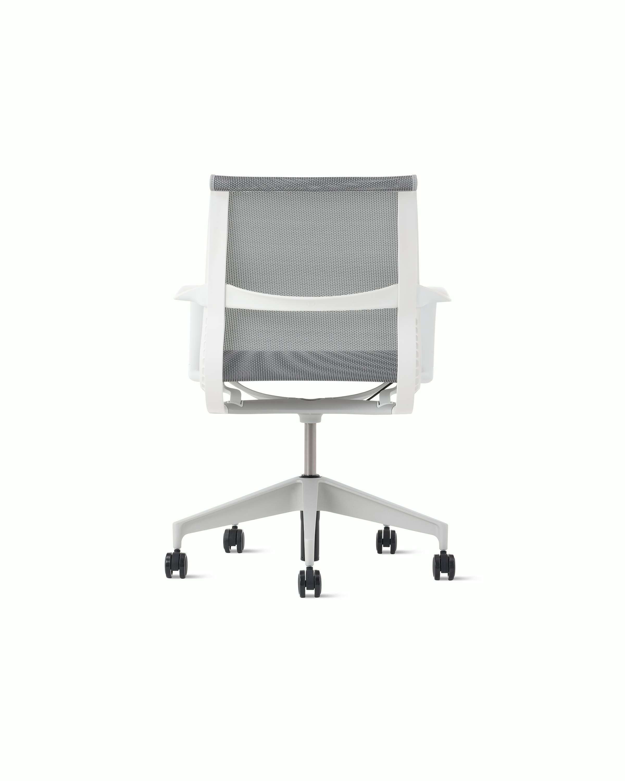 Rear view of a Setu chair with grey suspension, white frame and silver alloy base.