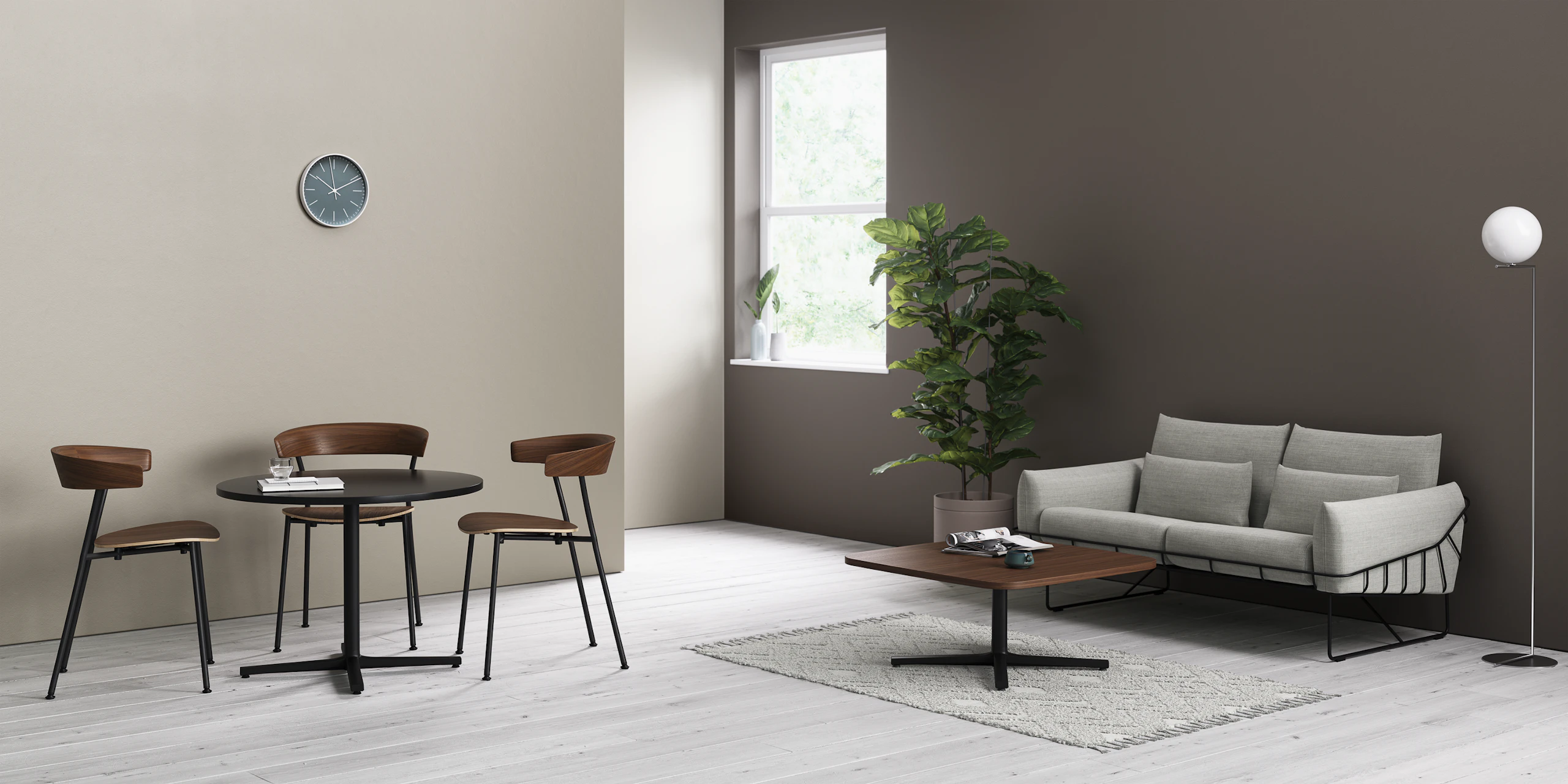 Two Everywhere Tables in an informal seating area, with wooden Leeway Chairs and a grey Wireframe Sofa.
