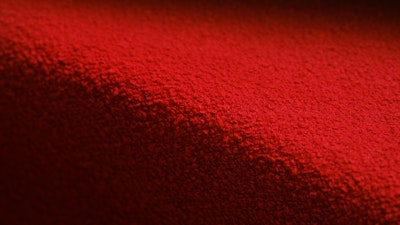 A close-up view of bright red fabric from Knoll Textiles