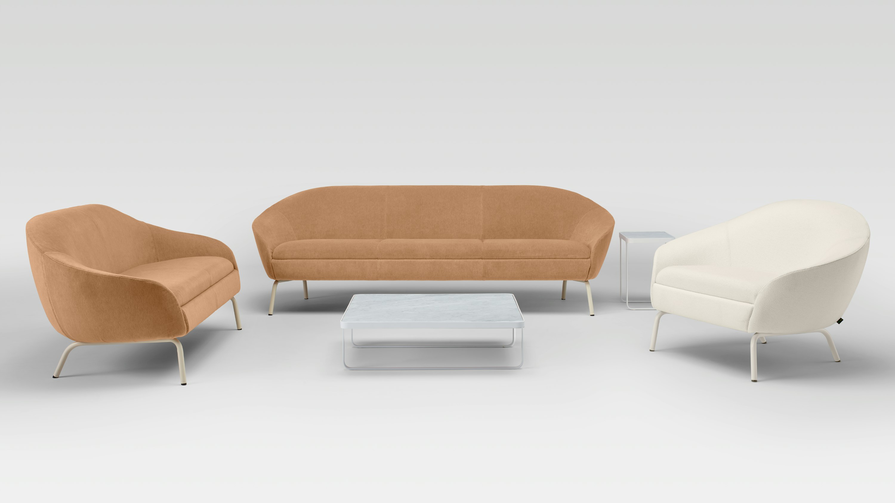 Two Ever Lounge Chairs and an Ever Sofa around a white coffee table.