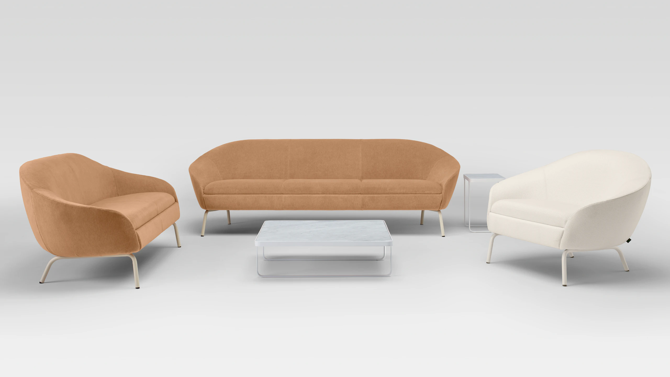 Two Ever Lounge Chairs and an Ever Sofa around a white coffee table.