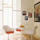 Saarinen Dining Table, Saarinen Tulip Arm Chair Saarinen Tulip Dining Table and Saarinen Tulip Chairs with Orange seat pads