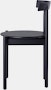 Profile view of a black Comma Chair.