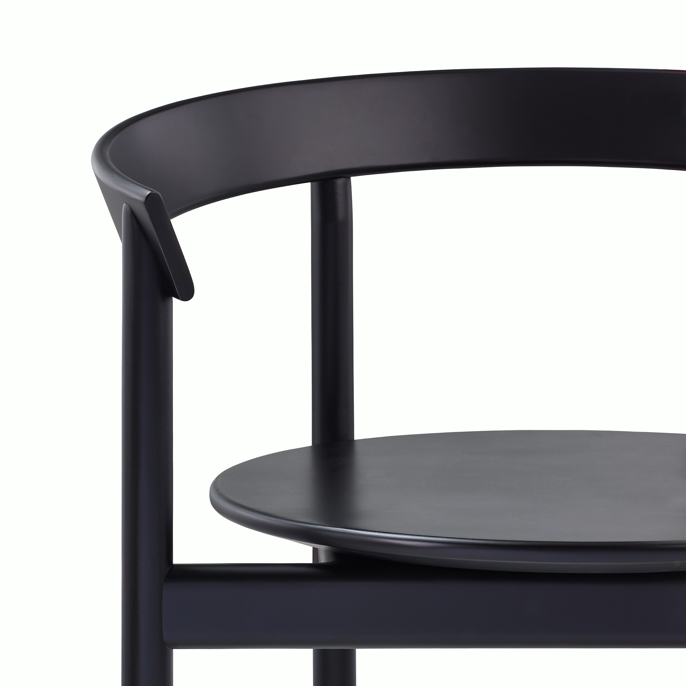 Close up detail of a Comma Chair with arms.