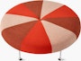 A Girard Color Wheel Ottoman upholstered in red fabrics, viewed from the top.