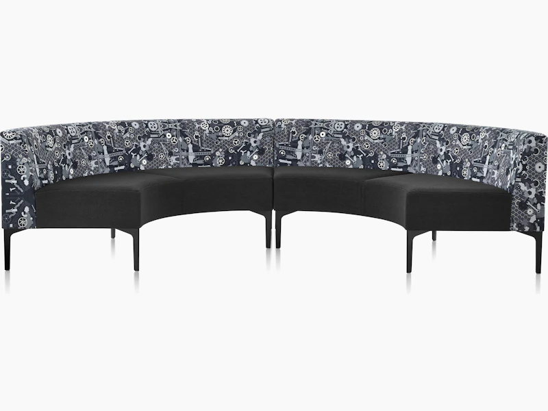 Two Symbol 90 Degree Curve Seats in black and Maharam Industry textiles with black steel legs.