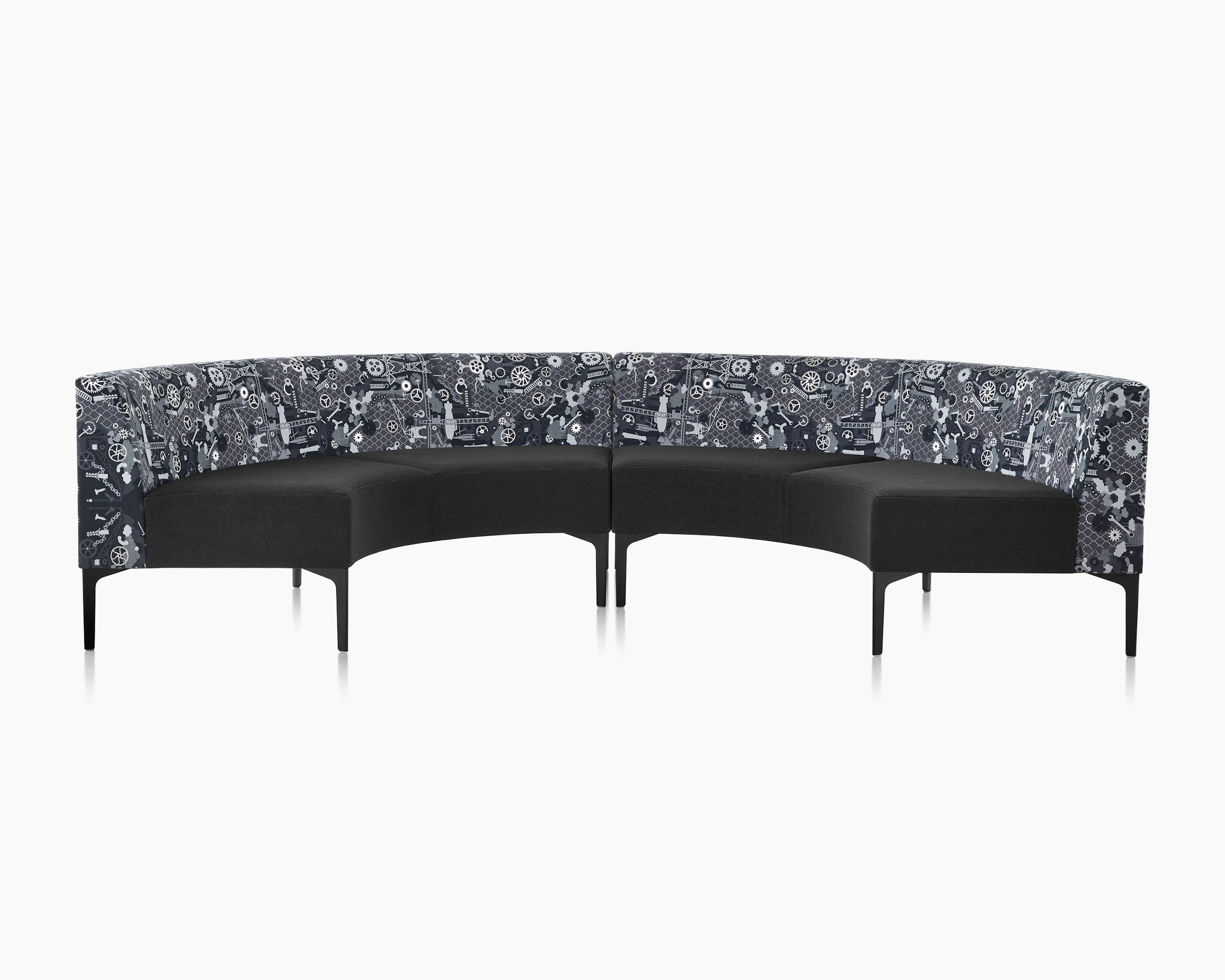 Two Symbol 90 Degree Curve Seats in black and Maharam Industry textiles with black steel legs.