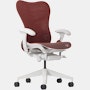 Front angle view of a Mirra 2 chair with a Butterfly back in cordovan and alpine frame.