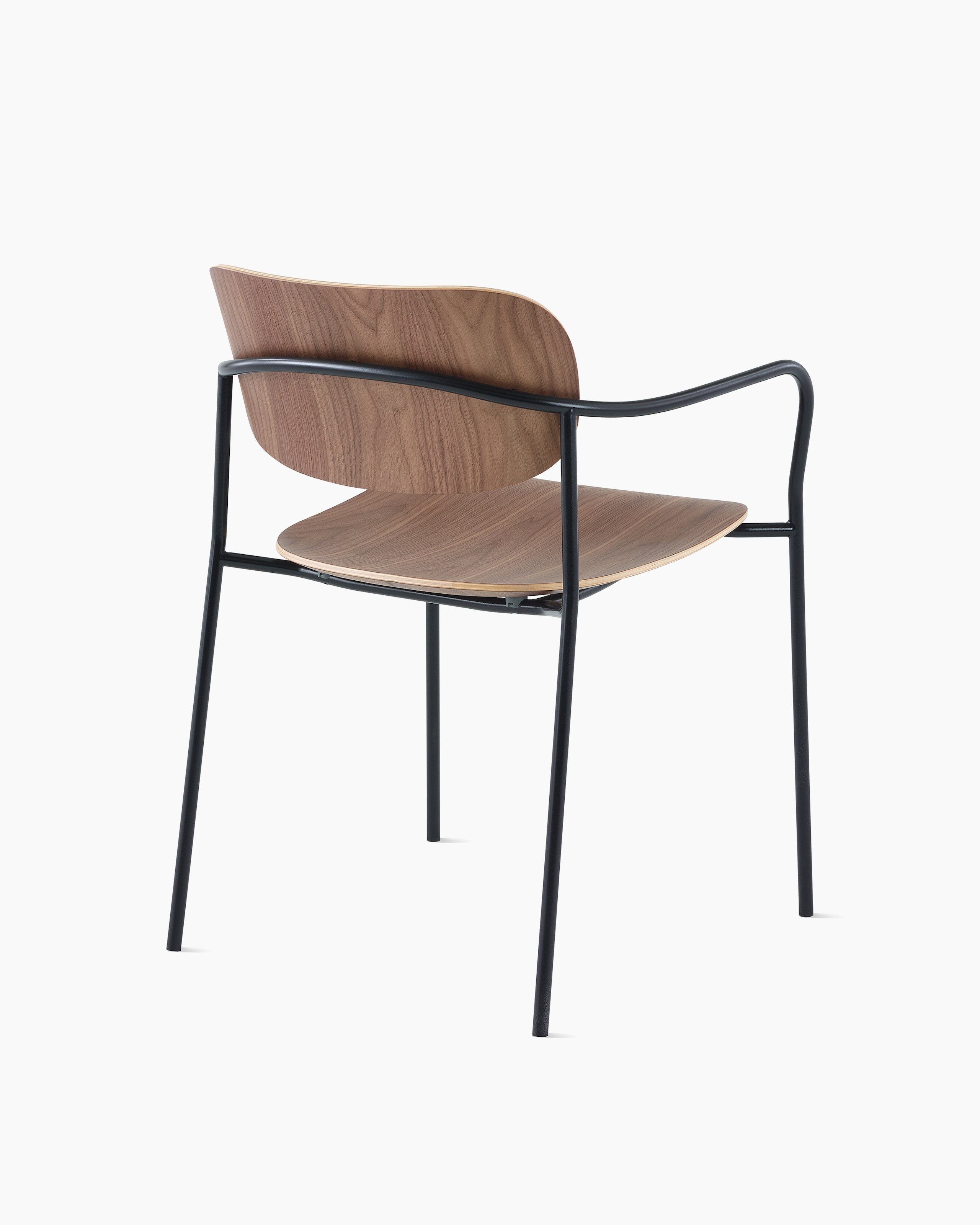 Portrait Chair with Walnut seat and back, and black frame with arms.