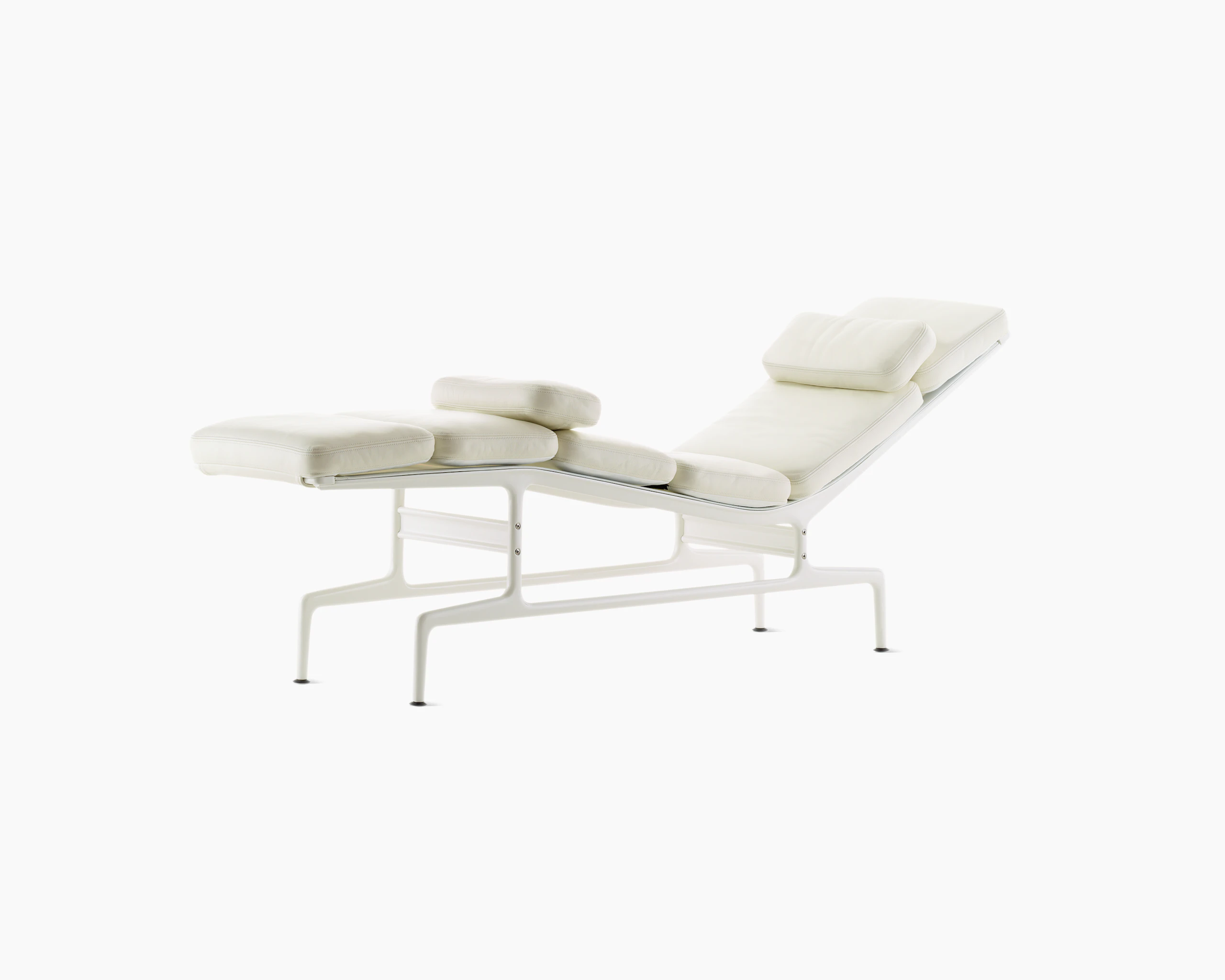 An all-white Eames Chaise, viewed from the front at an angle.