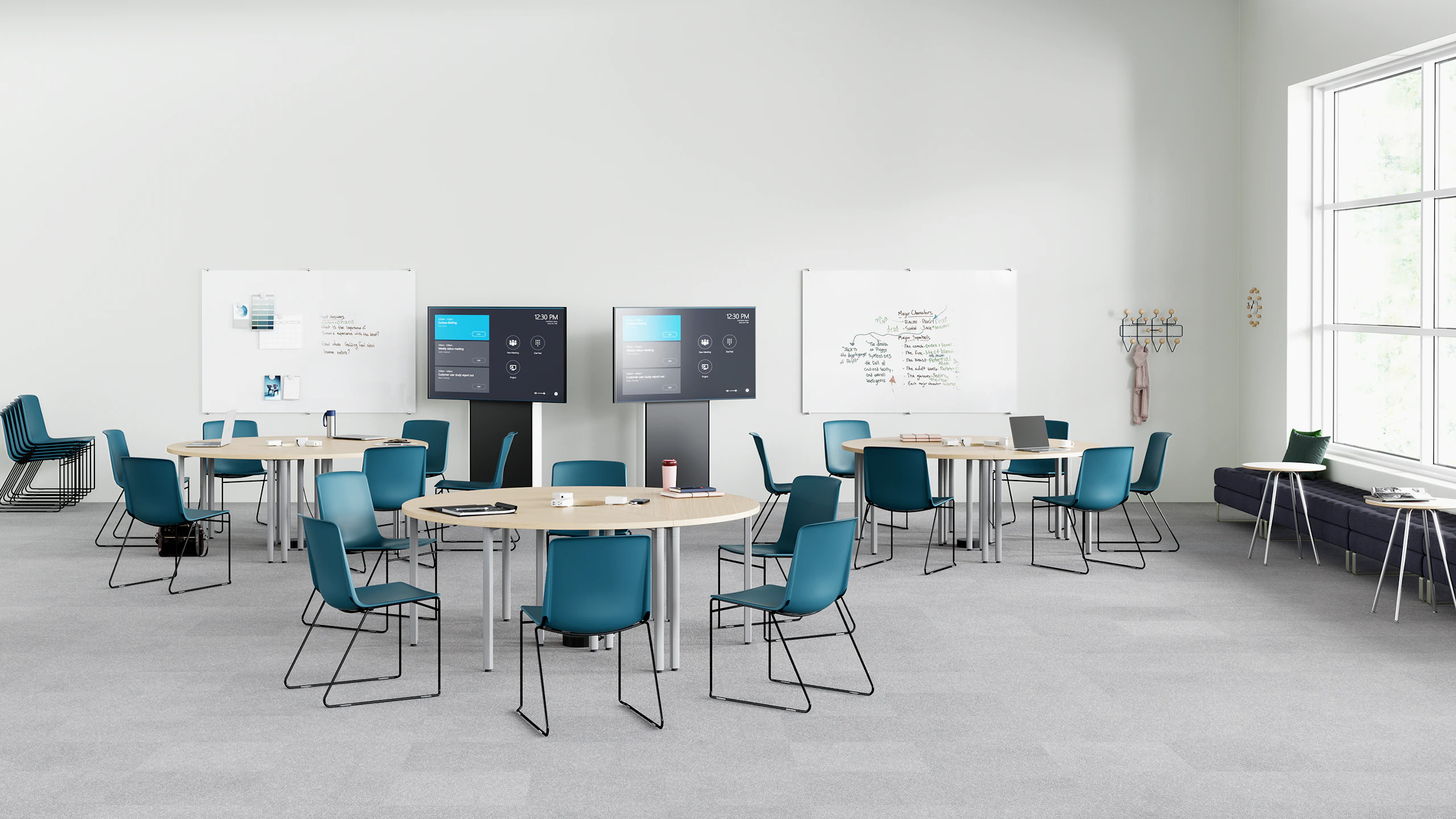 Peacock Pronta Stacking Chairs in a corporate learning space with Everywhere Tables, AVVC One media displays, and glass white boards.