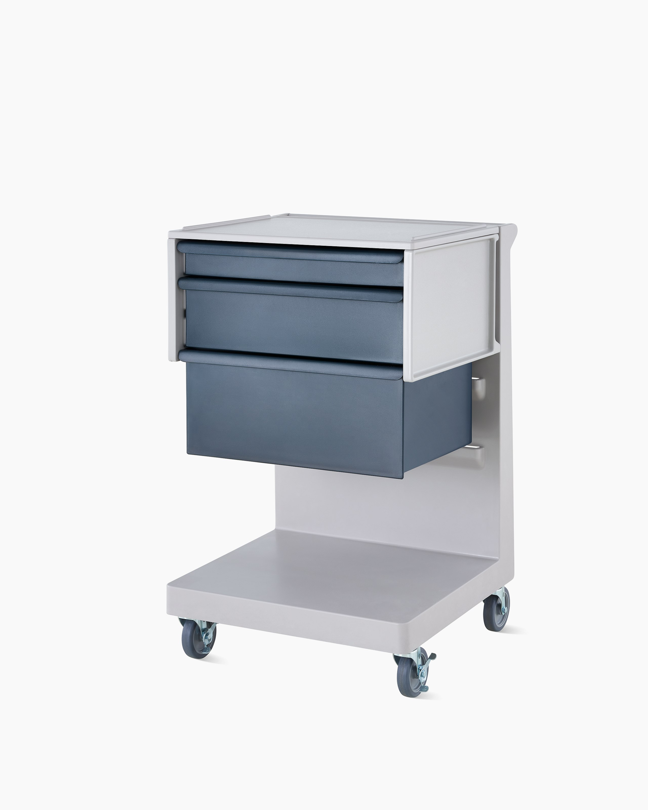 Detail of mobile Procedure and Supply L Cart and C Frame in a soft white body and dark blue modular drawers.