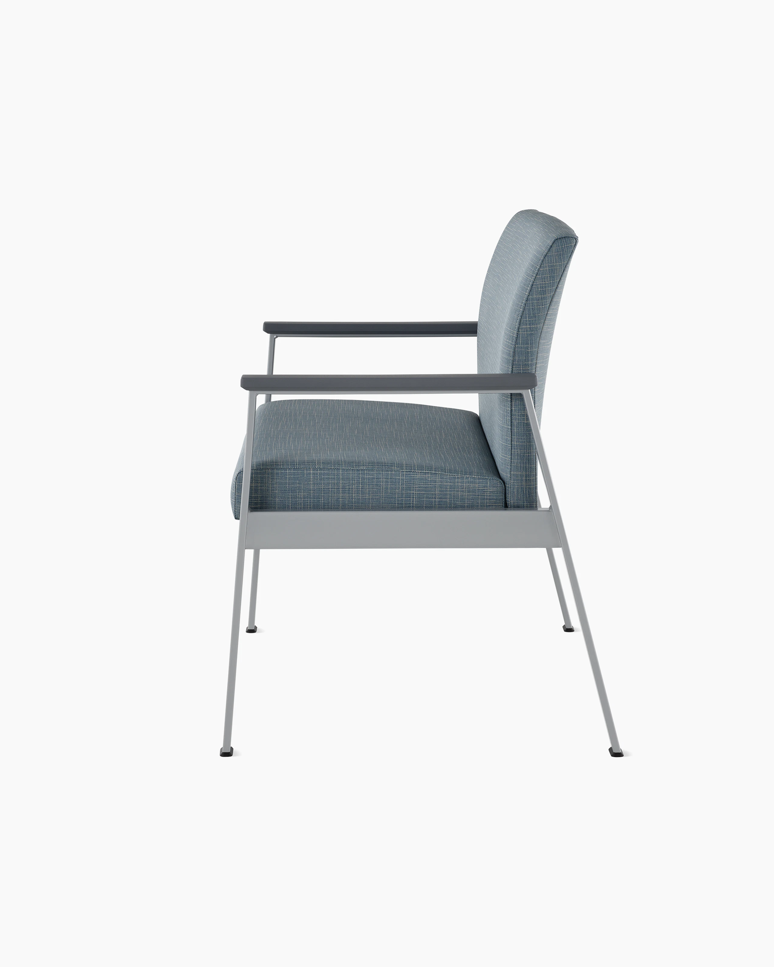 Side view of an Easton Plus Chair with blue upholstery, metallic four leg base and slate grey arm caps.