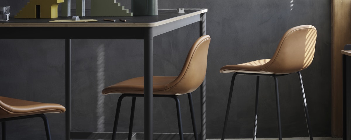 Three Fiber Counter Stools at an industrial workspace counter