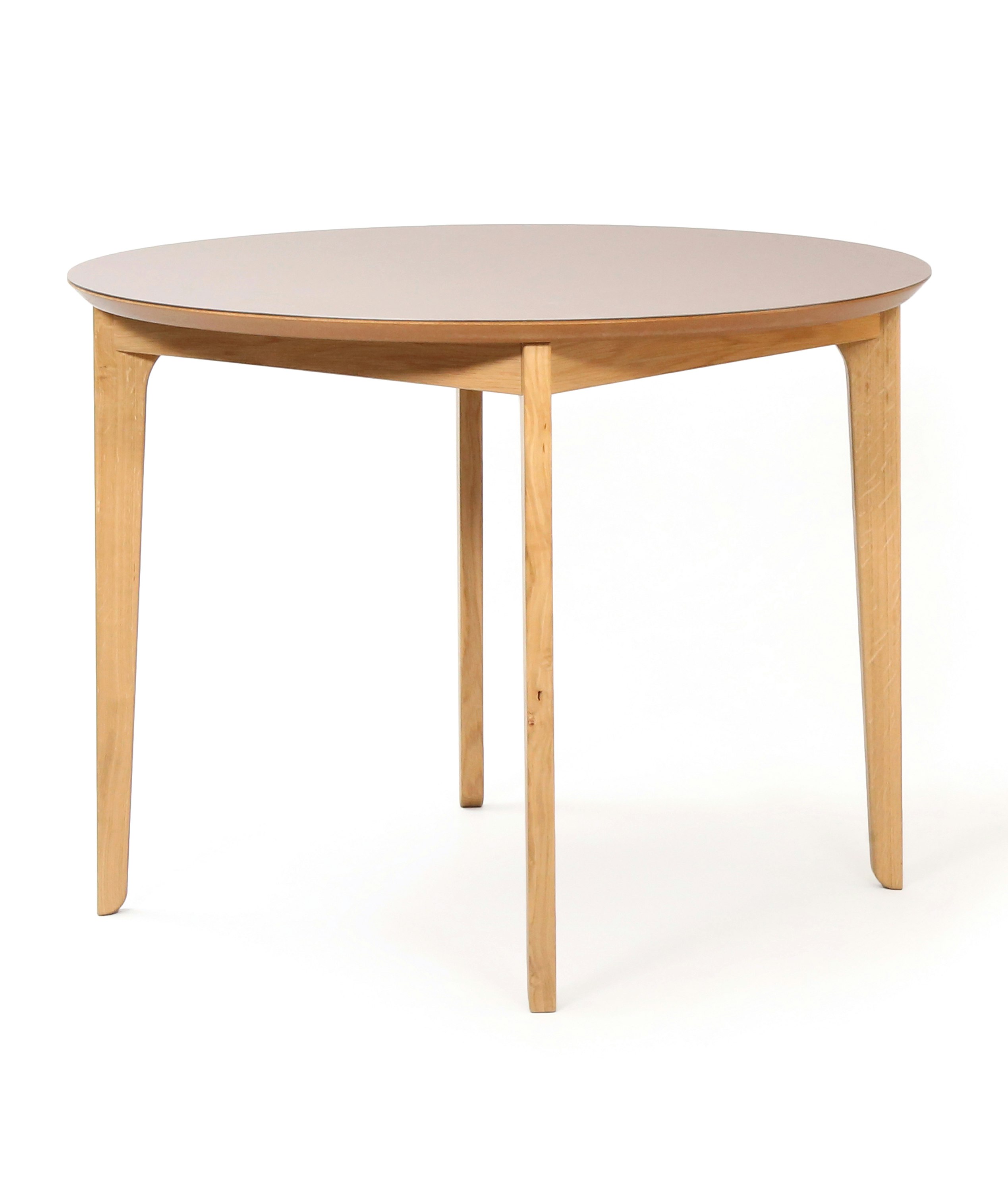 A round naughtone Dalby Café Table, viewed at an angle.