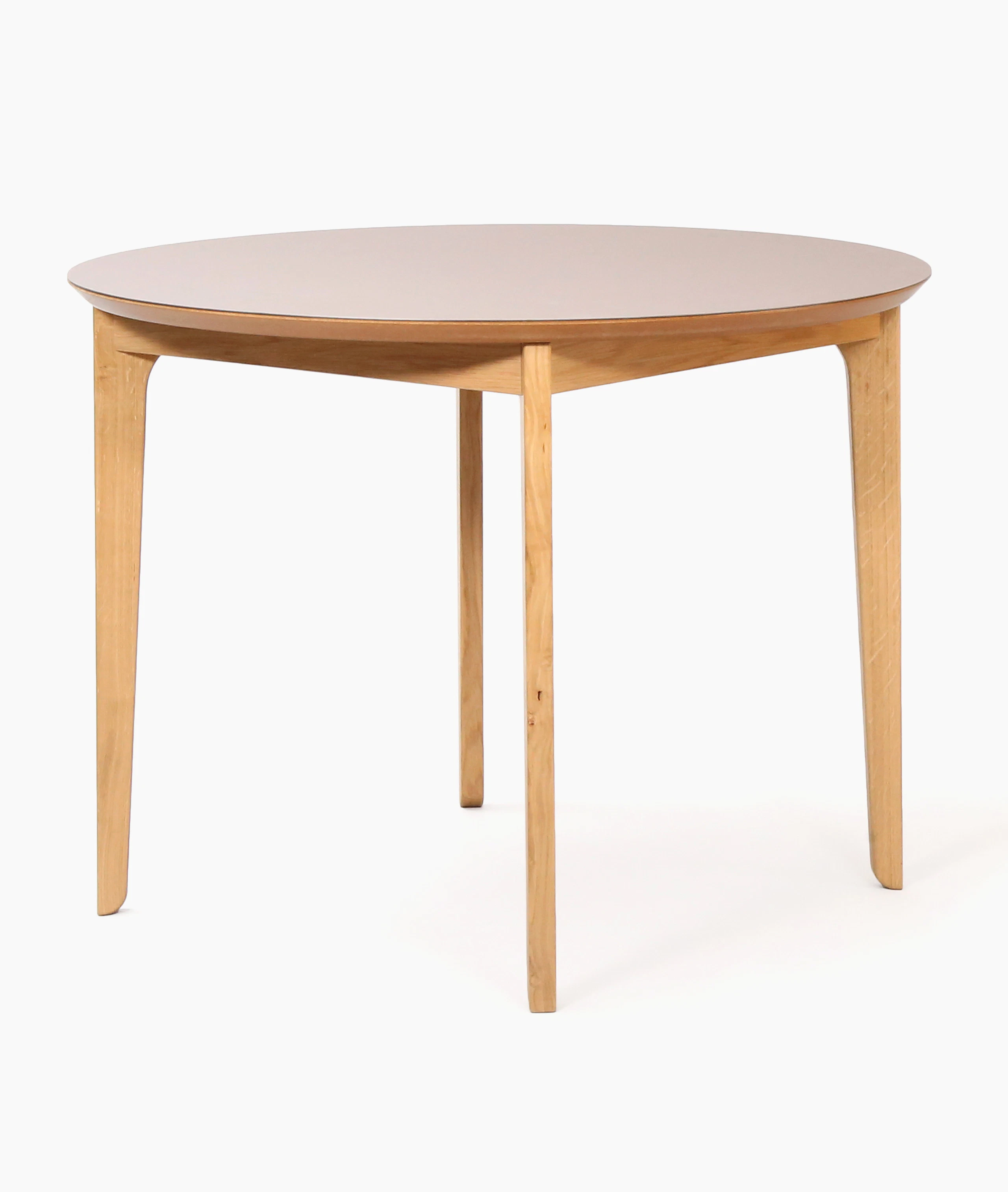 A round naughtone Dalby Café Table, viewed at an angle.