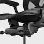 Aeron Chair on a white background with detailed side view of the chair tilt mechanism. 