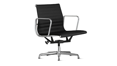A front 3/4 view of a black and silver Eames Aluminum Group chair on a white background