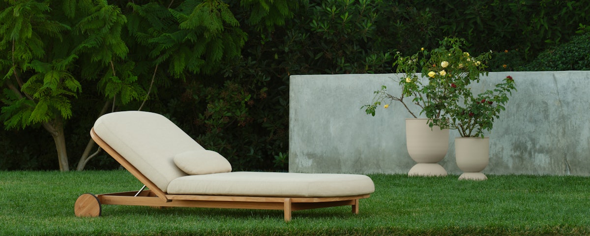 Softlands Outdoor Adjustable Chaise Lounge in an outdoor lawn setting