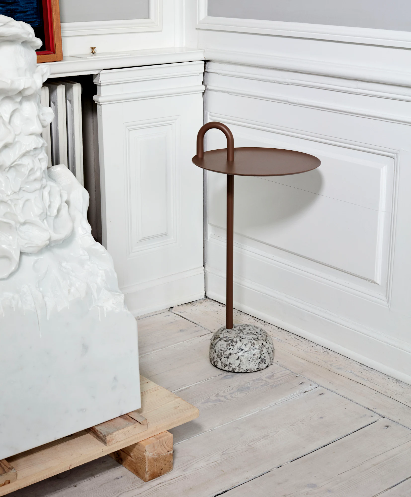 White bowler side table with circular top and arched handle detail