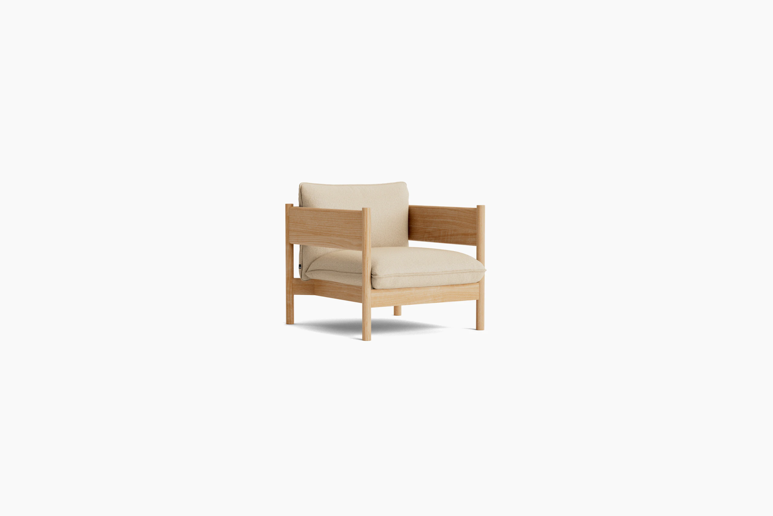 Arbour Club Armchair with oiled oak base and tan upholstery viewed from an angle