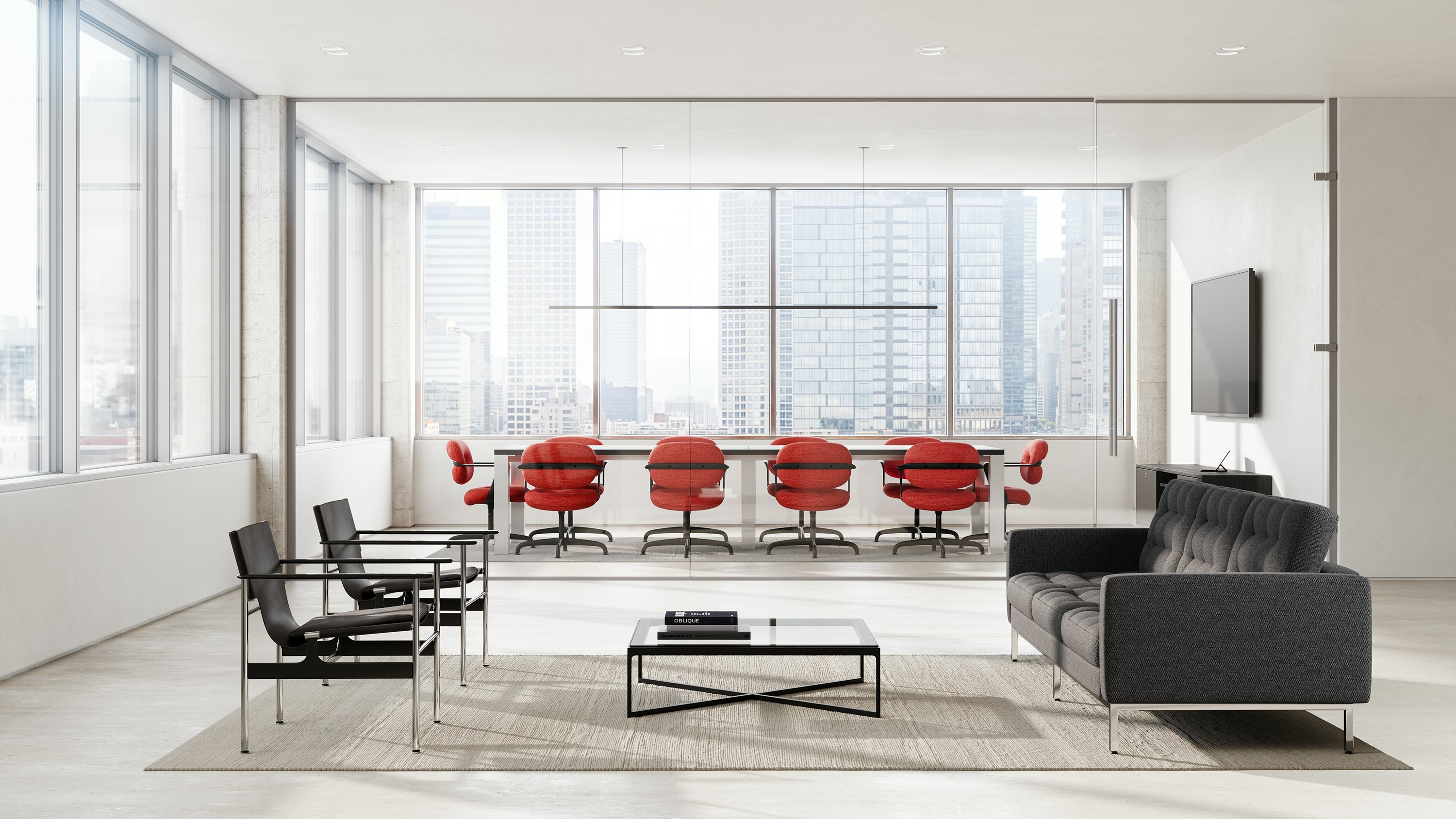 Ten Morrison Hannah side chairs in red surround a table in a conference room with a waiting area with a sofa and chairs in front.