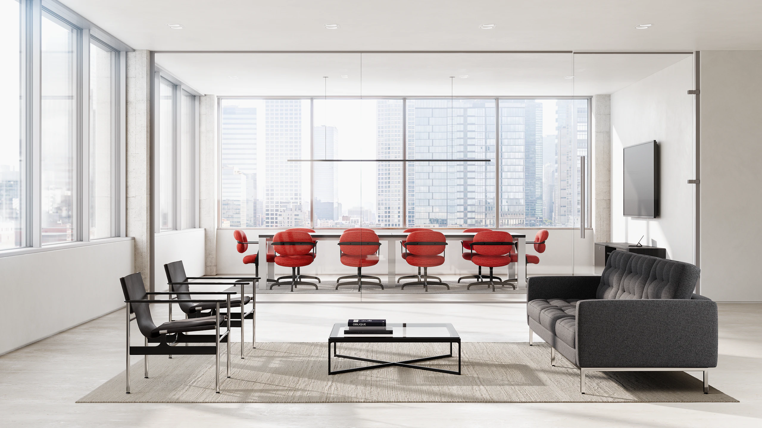 Ten Morrison Hannah side chairs in red surround a table in a conference room with a waiting area with a sofa and chairs in front.