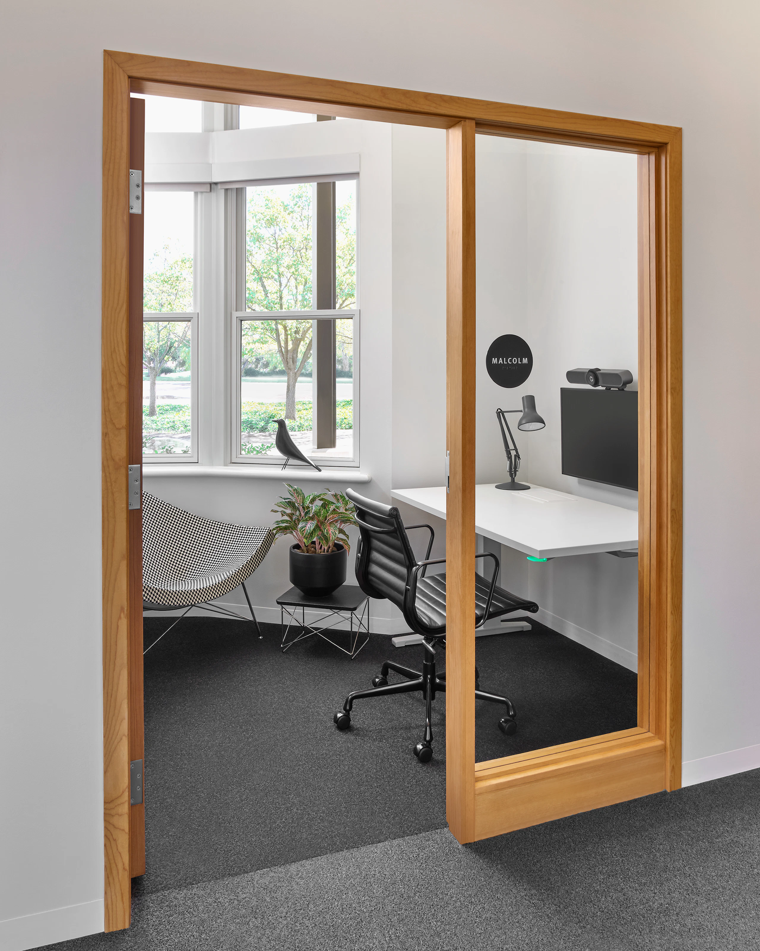 A private office with Renew Rectangular Table next to an Eames Aluminum Group Management Chair.