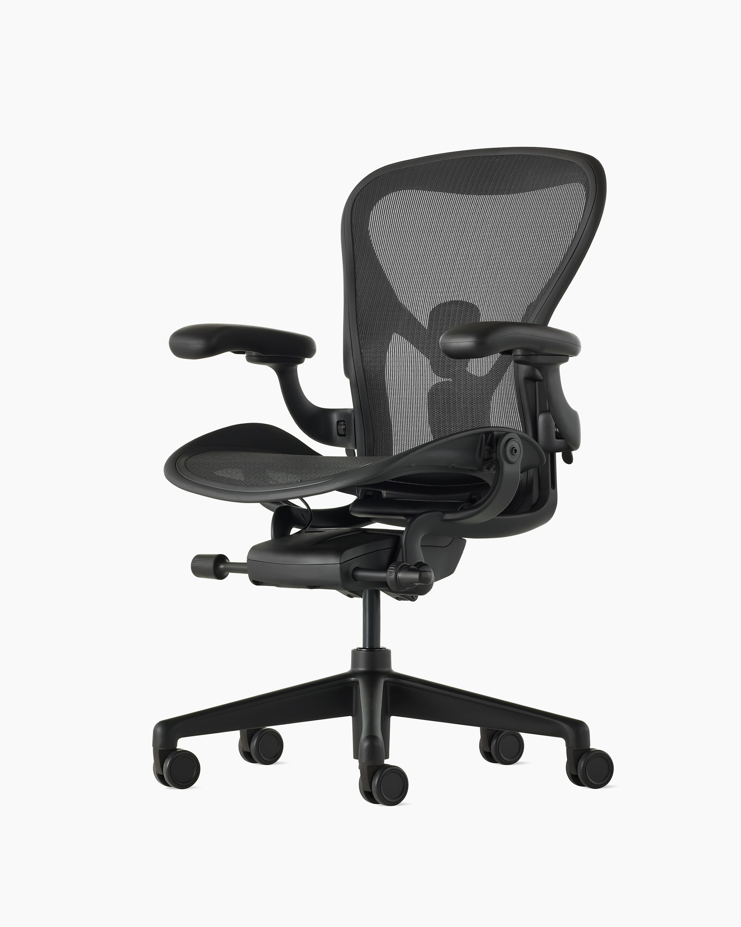 Black matte Aeron Chair on a white background with a 5-star base and ergonomic back support, viewed at an angle.