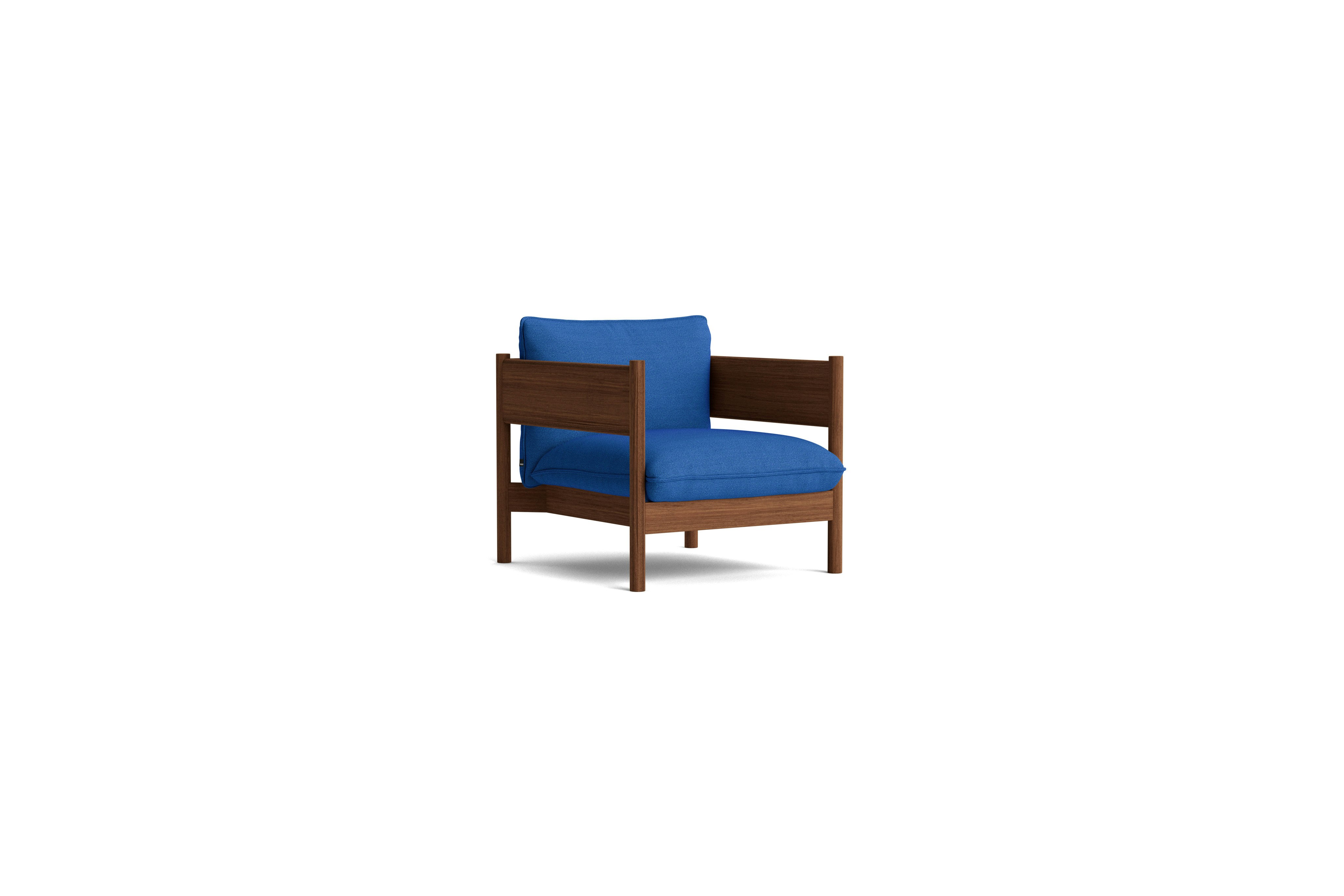 Arbour Club Armchair with walnut base and blue upholstery viewed from an angle