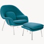 An aegean Womb Chair & Ottoman viewed from an angle