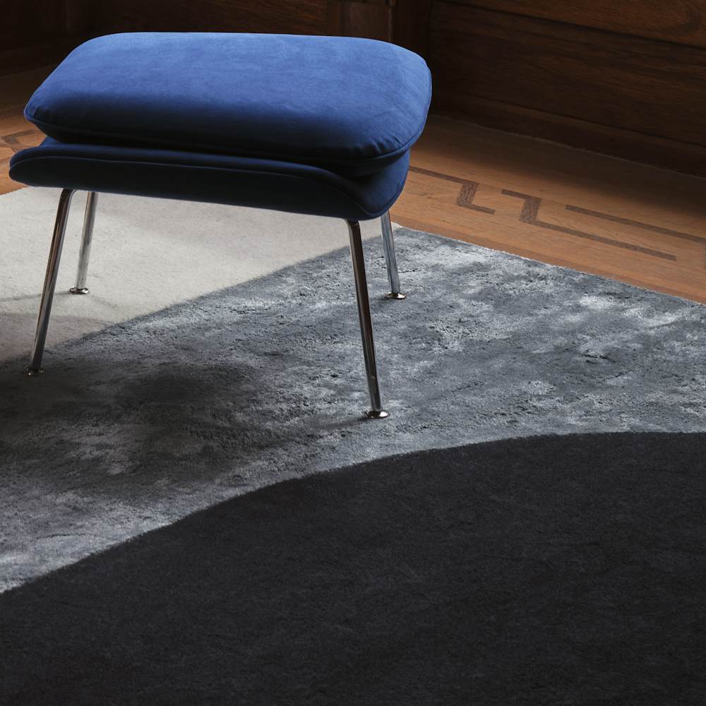 Womb Chair and Ottoman in Indigo Ultrasuede and Vilja Rug