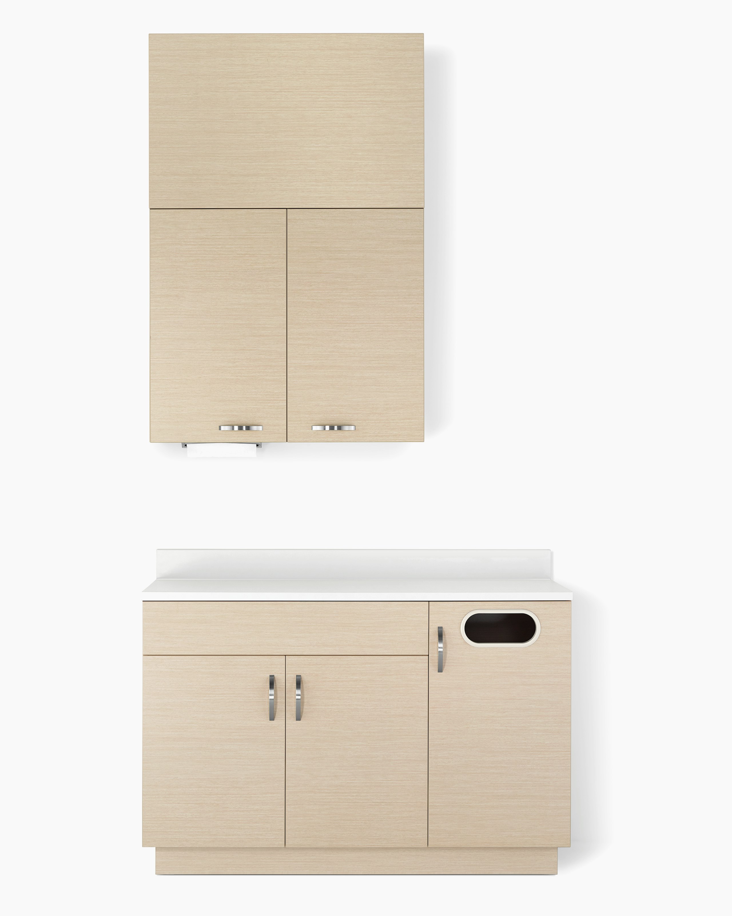 Mora casework in an ash wood finish with a lower cabinet with double doors and a trash cabinet and white solid surface top, along with an upper storage unit with double doors and a soffit above.