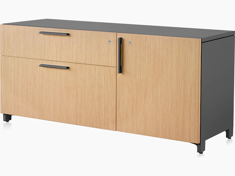 Brown and black Tu Wood individual credenza with two box drawers and door, viewed at an angle.