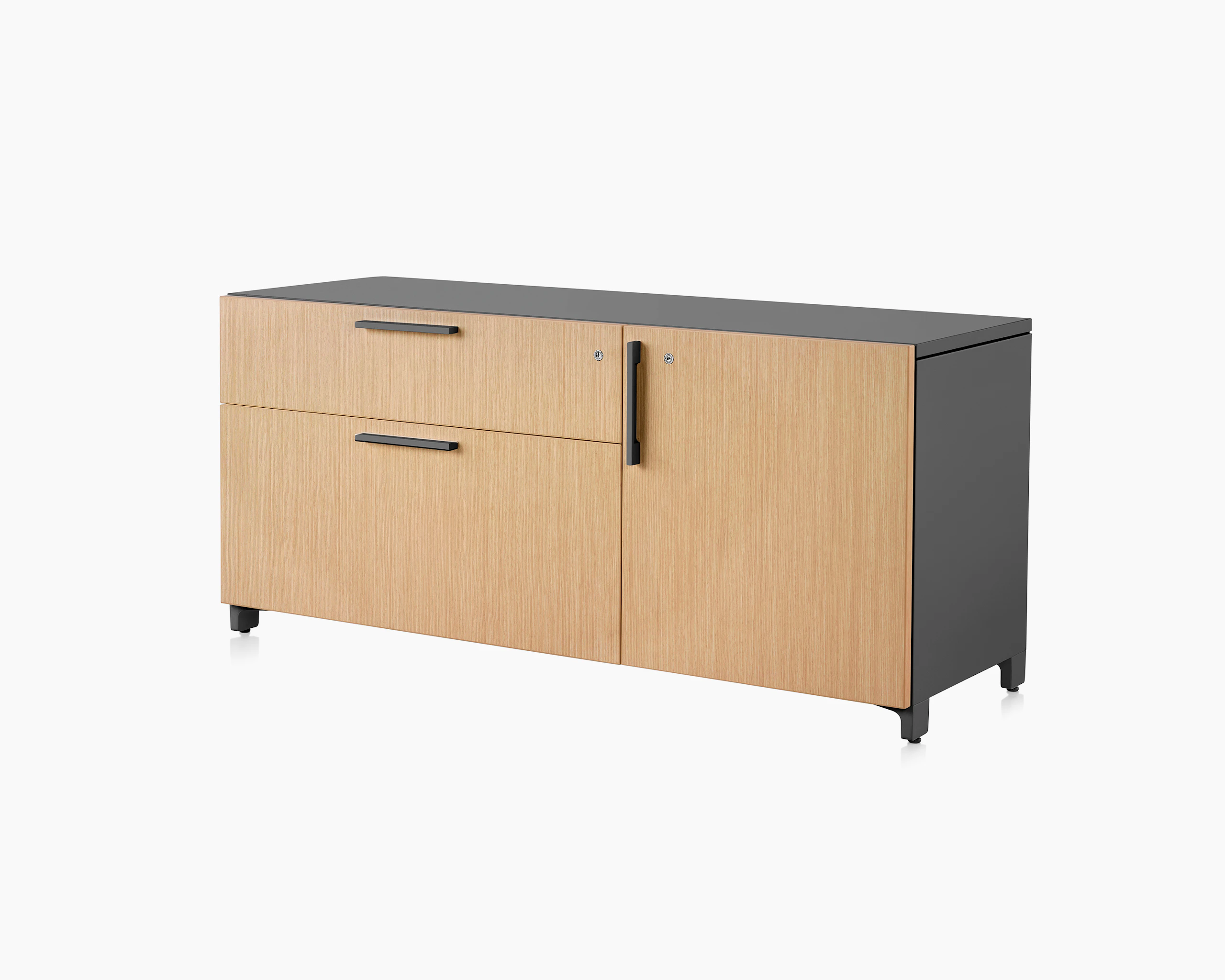 Brown and black Tu Wood individual credenza with two box drawers and door, viewed at an angle.