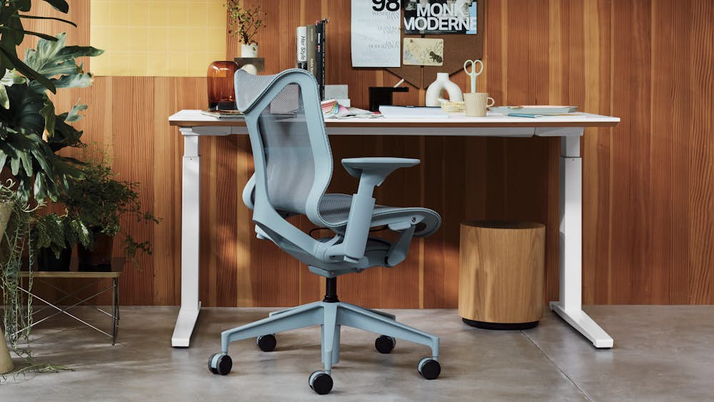 Renew Sit-to-Stand Desk,  Aeron Chair,  Nelson Face Print,  and Eames Wire Base Low Table