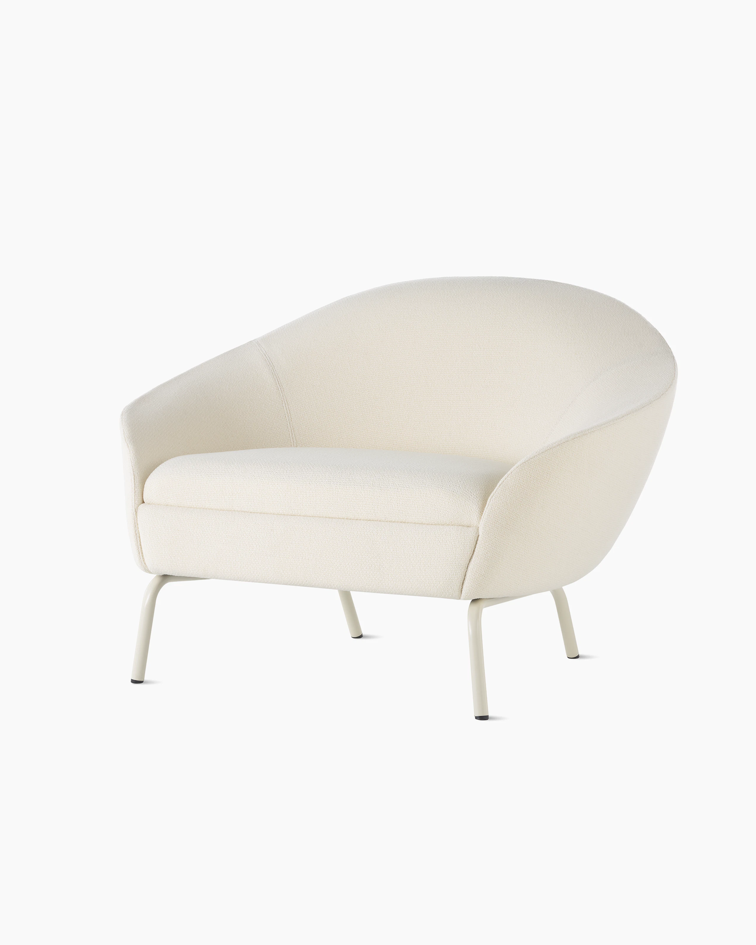 A front angled view of cream upholstered Ever Lounge Chair with oyster steel legs. Select to go to the Ever Lounge Chair product page.