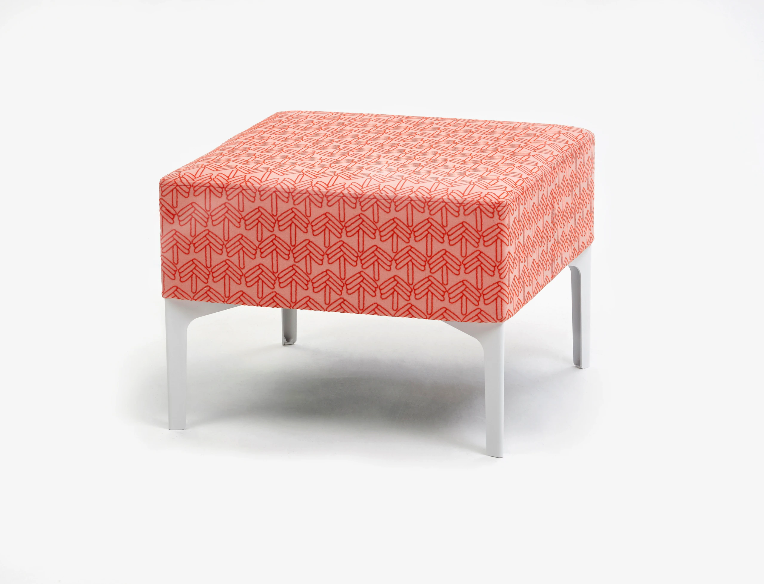 A front angle view of the Symbol Single Stool in a coral pattern.