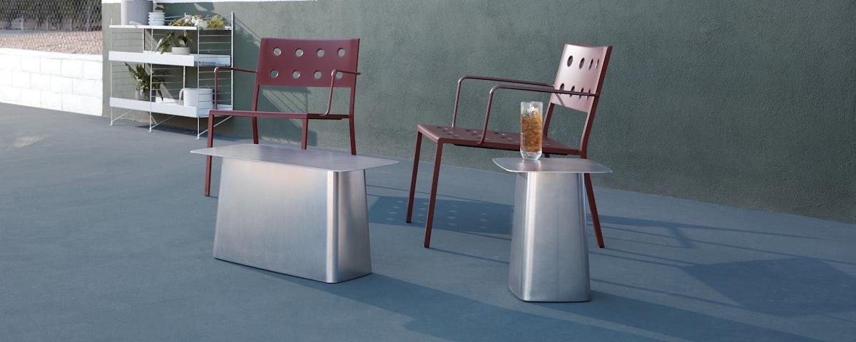 Vitra Metal Side Table and Balcony Lounge Chairs in an outdoor patio setting