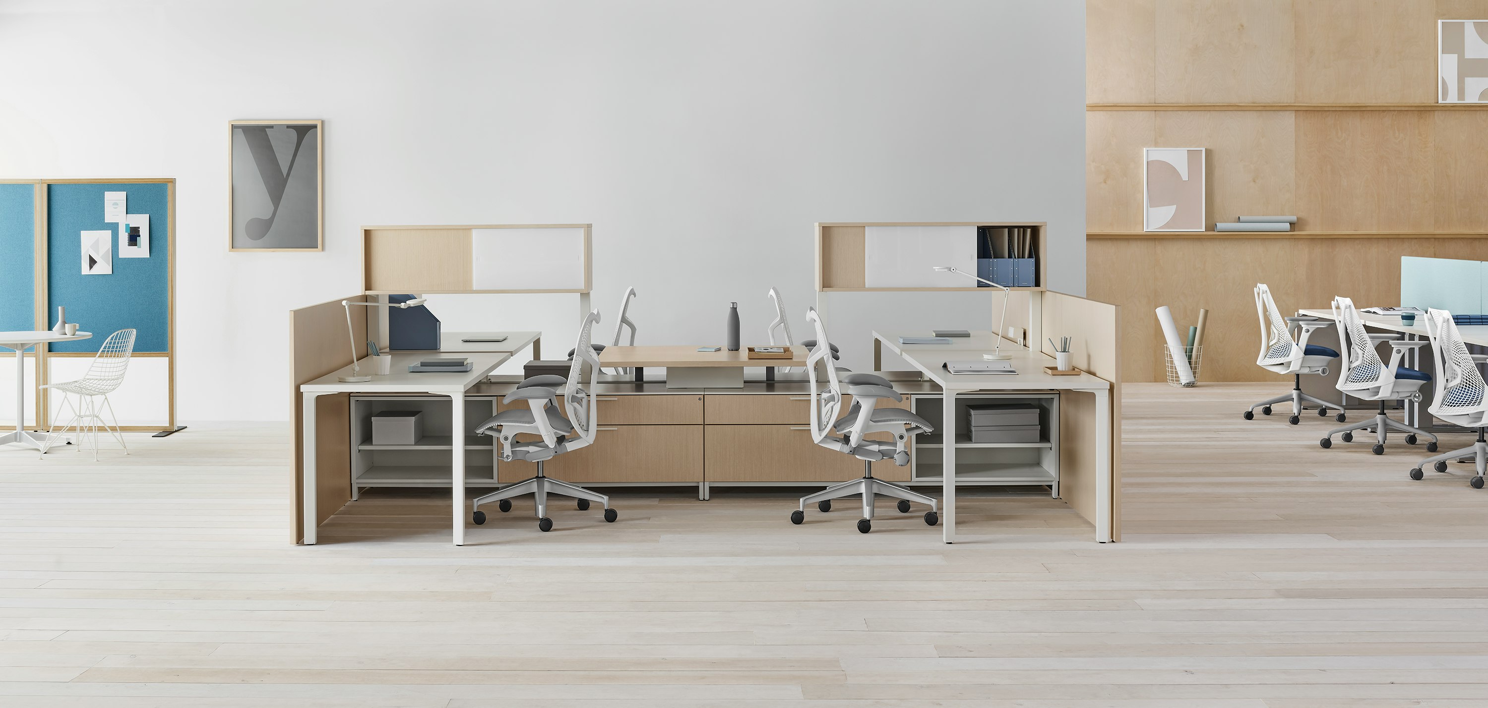 Canvas Dock 4-pack workstation with upper storage, gallery panels, and gray Mirra 2 chairs.