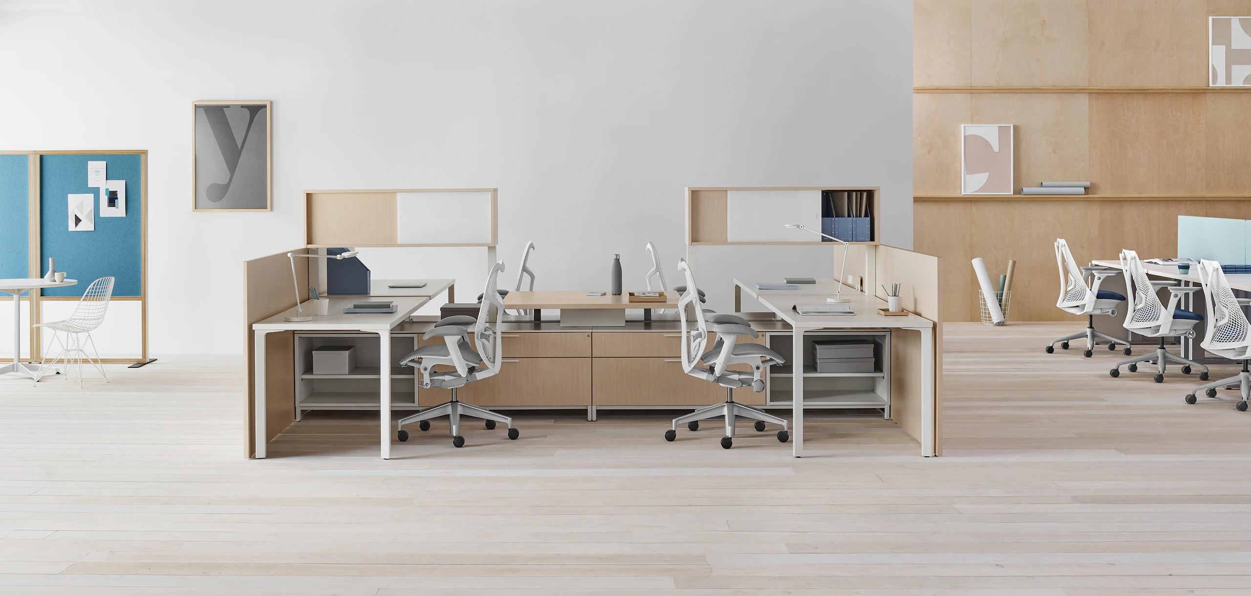 Canvas Dock 4-pack workstation with upper storage, gallery panels, and gray Mirra 2 chairs.