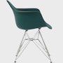 Side of evergreen plastic shell chair with wire base legs.