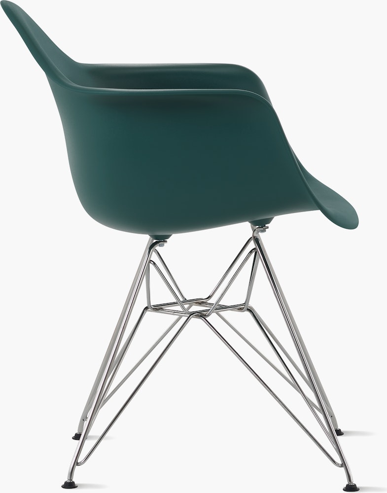 Side of evergreen plastic shell chair with wire base legs.
