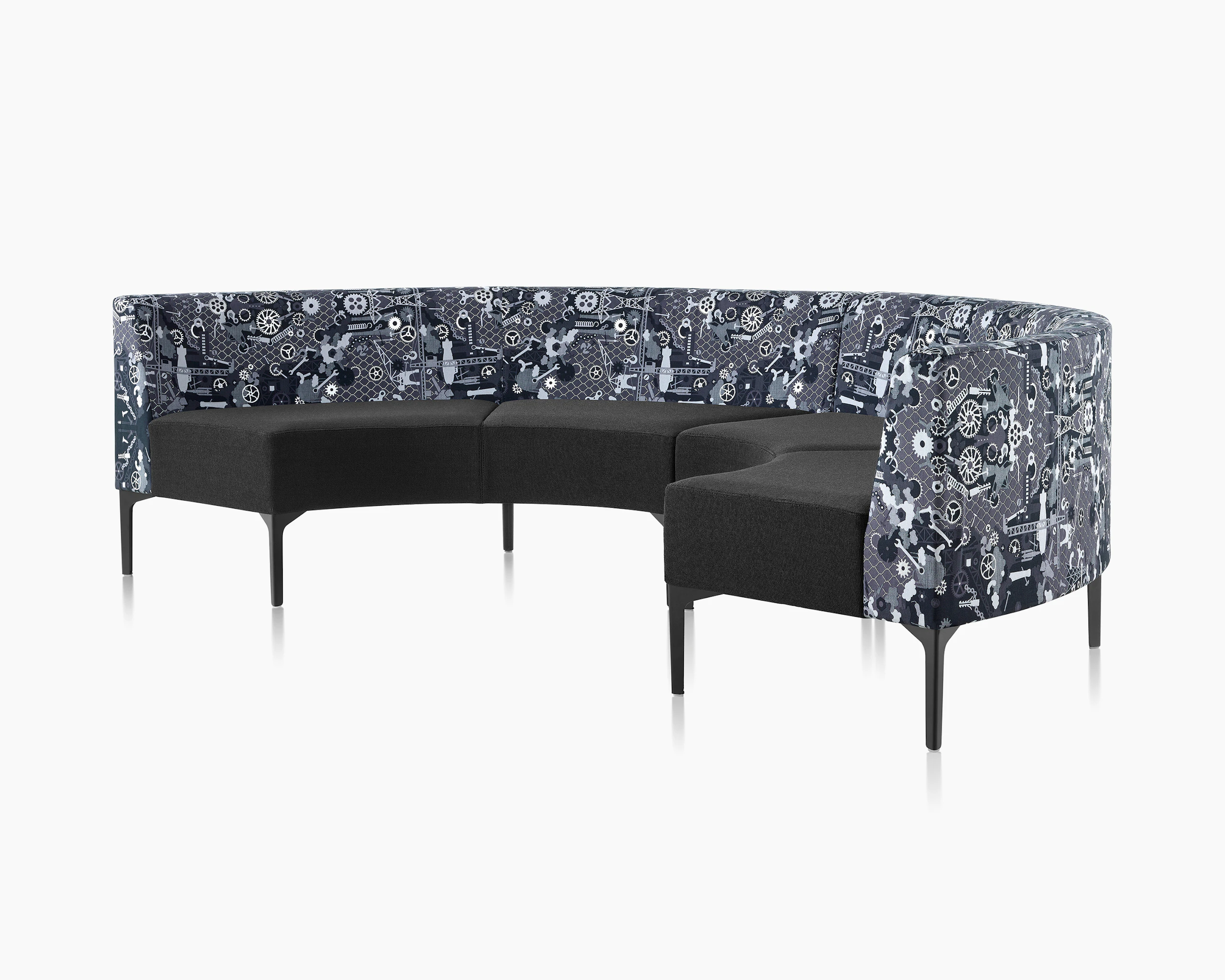 Two Symbol 90 Degree Curve Seats in black and Maharam Industry textiles with black steel legs.