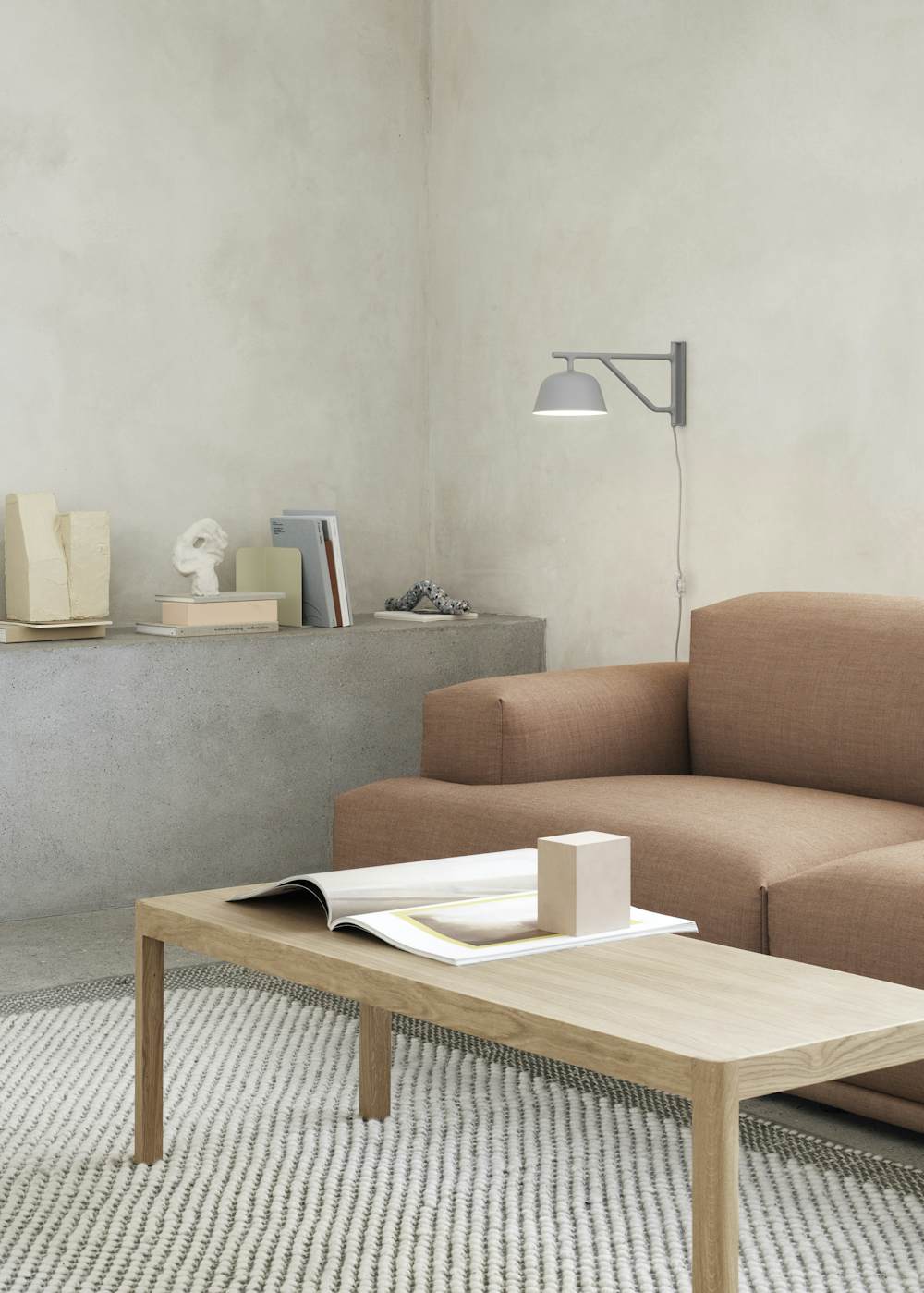 Ambit Wall Lamp above a In Situ Sofa and Workshop Coffee Table in a living room setting