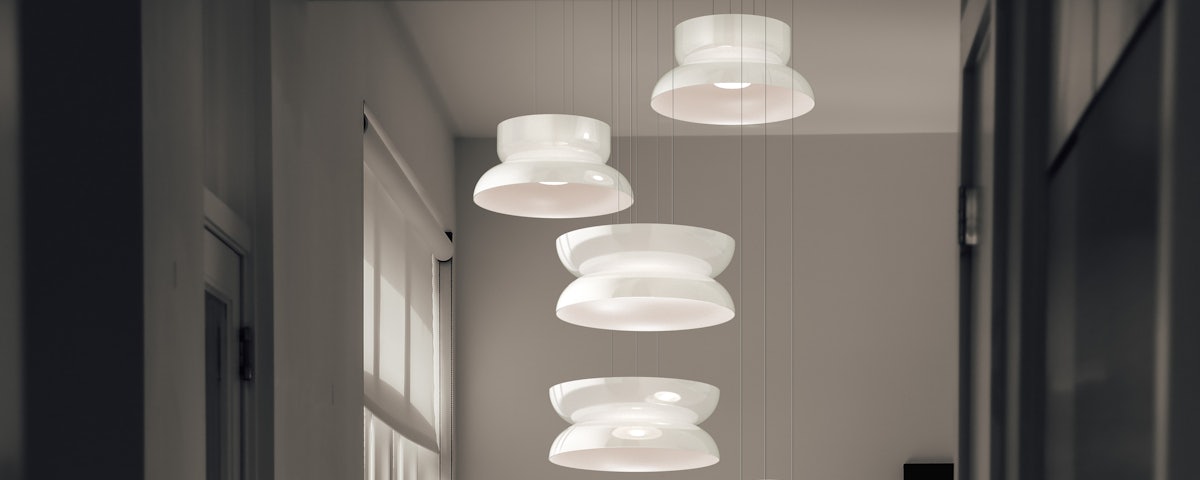 Four Totem Up Down Pendants suspended from a ceiling