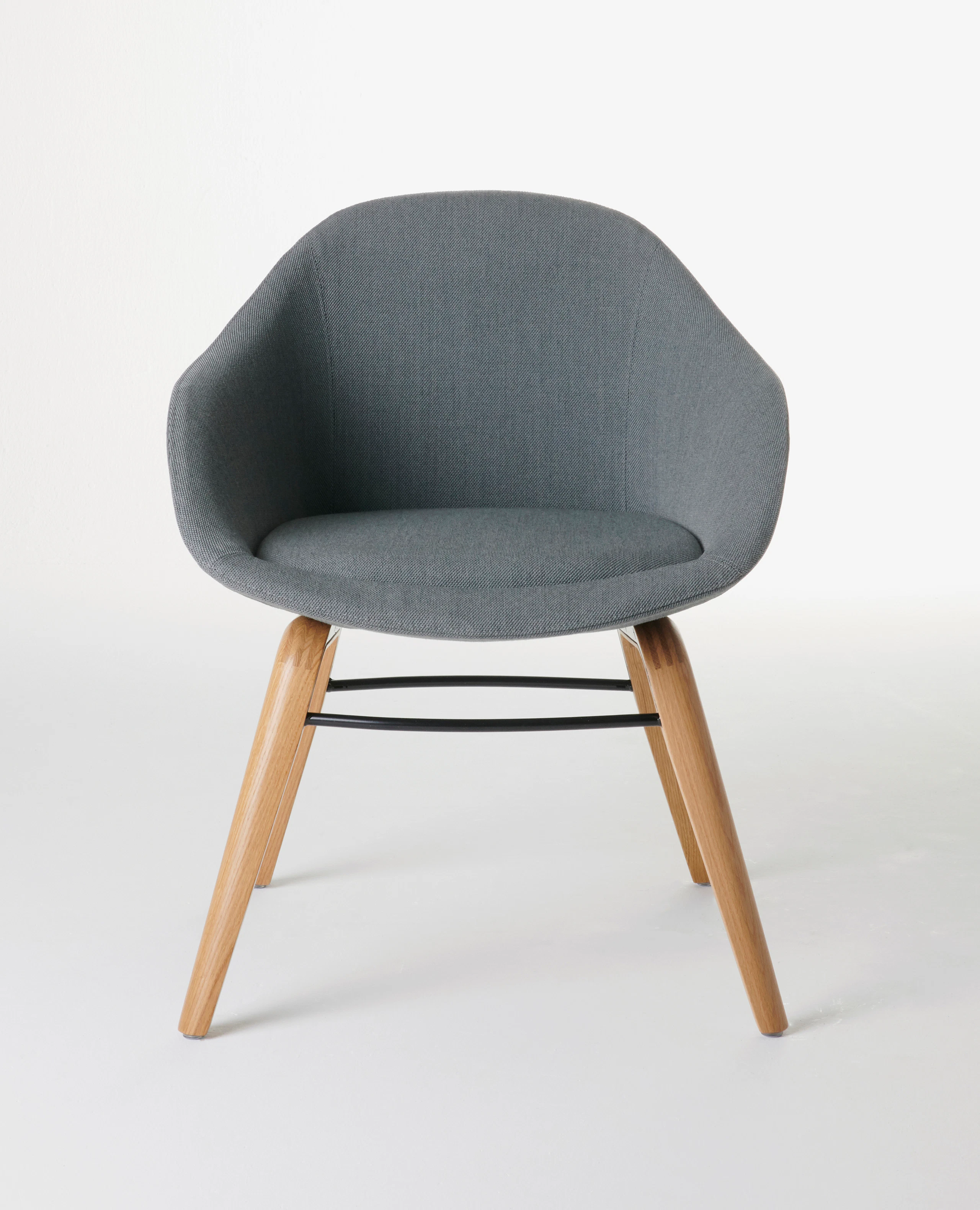 White sweep shot of dark grey Always Side Chair with solid oak base.